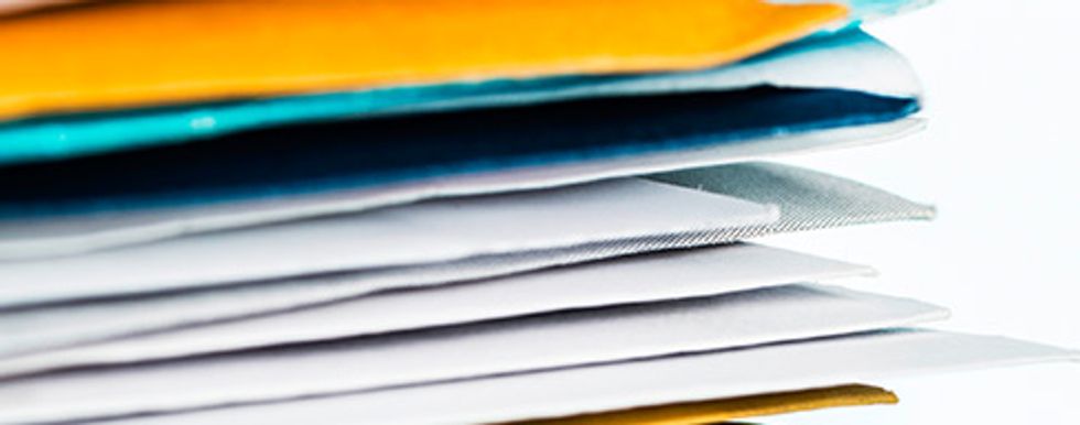 "Closeup of stacks of mail"