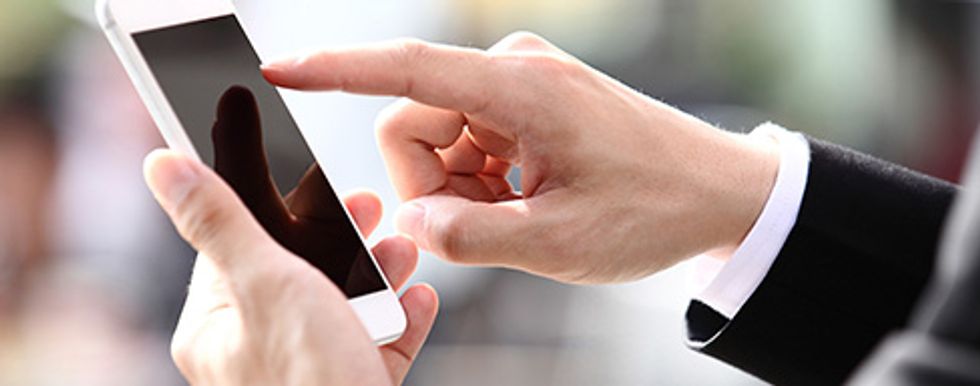 Closeup of a hand touching a smartphone screen
