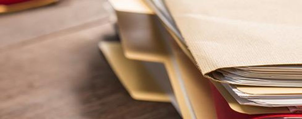 Closeup photo of a stack of files.