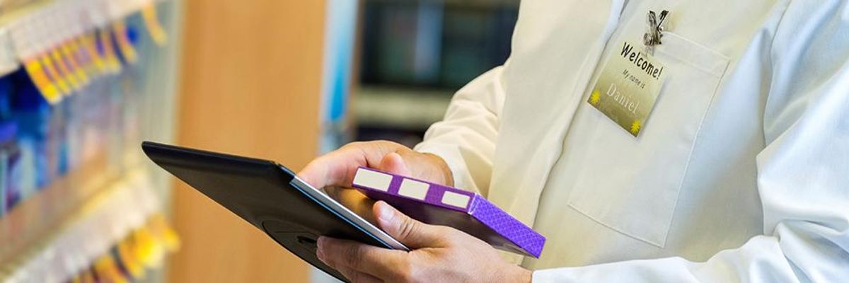 Doctor checking medication on tablet