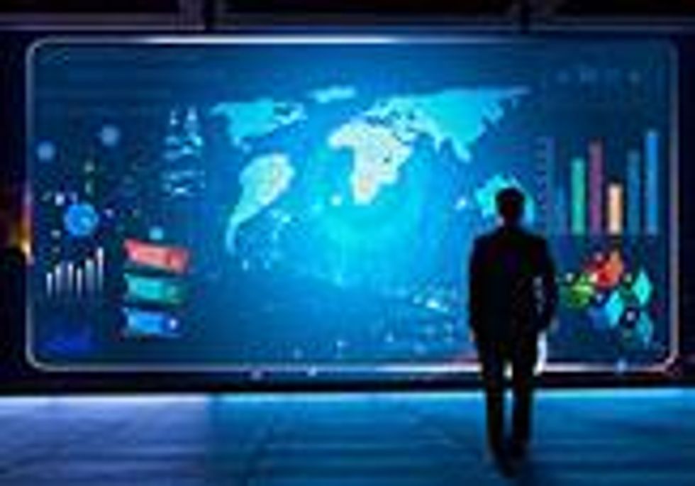 man infront of digital display