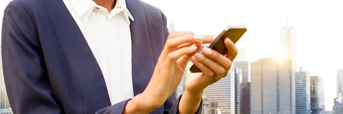 professional using phone in sunlight